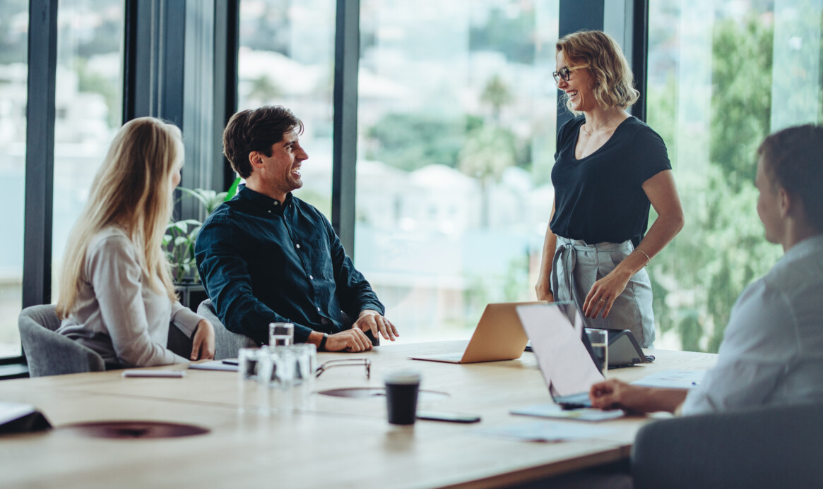 Group of happy corporate people in a meeting