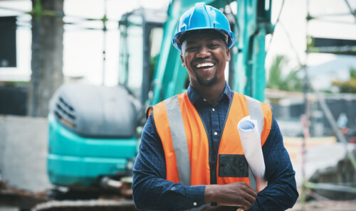 We have some prime property popping up here soon. Portrait of a young man working at a construction site.